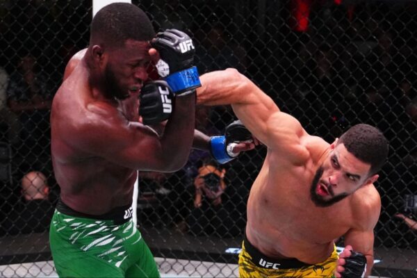UFC fighter Gabriel Bonfim lands a hard right punch on Randy Brown's head during their fight in the octagon.