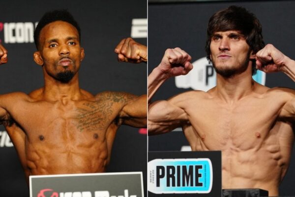 Lutadores do UFC, Lerone Murphy e Movsar Evloev, posam flexionando os músculos na pesagem oficial.