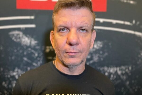 MMA coach André 'Dedé' Pederneiras looks seriously at the camera in a close-up headshot.