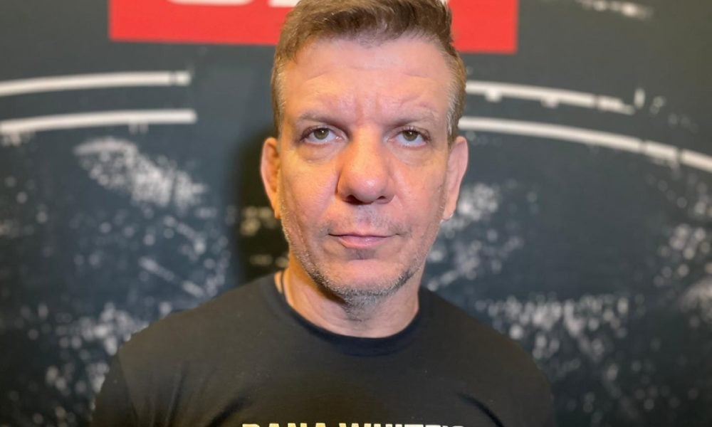 MMA coach André 'Dedé' Pederneiras looks seriously at the camera in a close-up headshot.